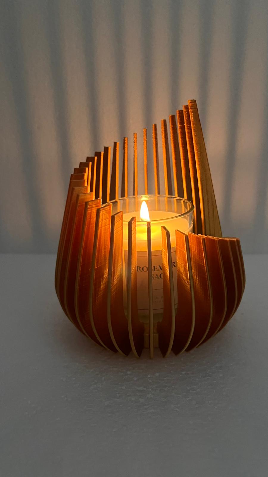 Portacandela decorativo con candela in vetro profumata